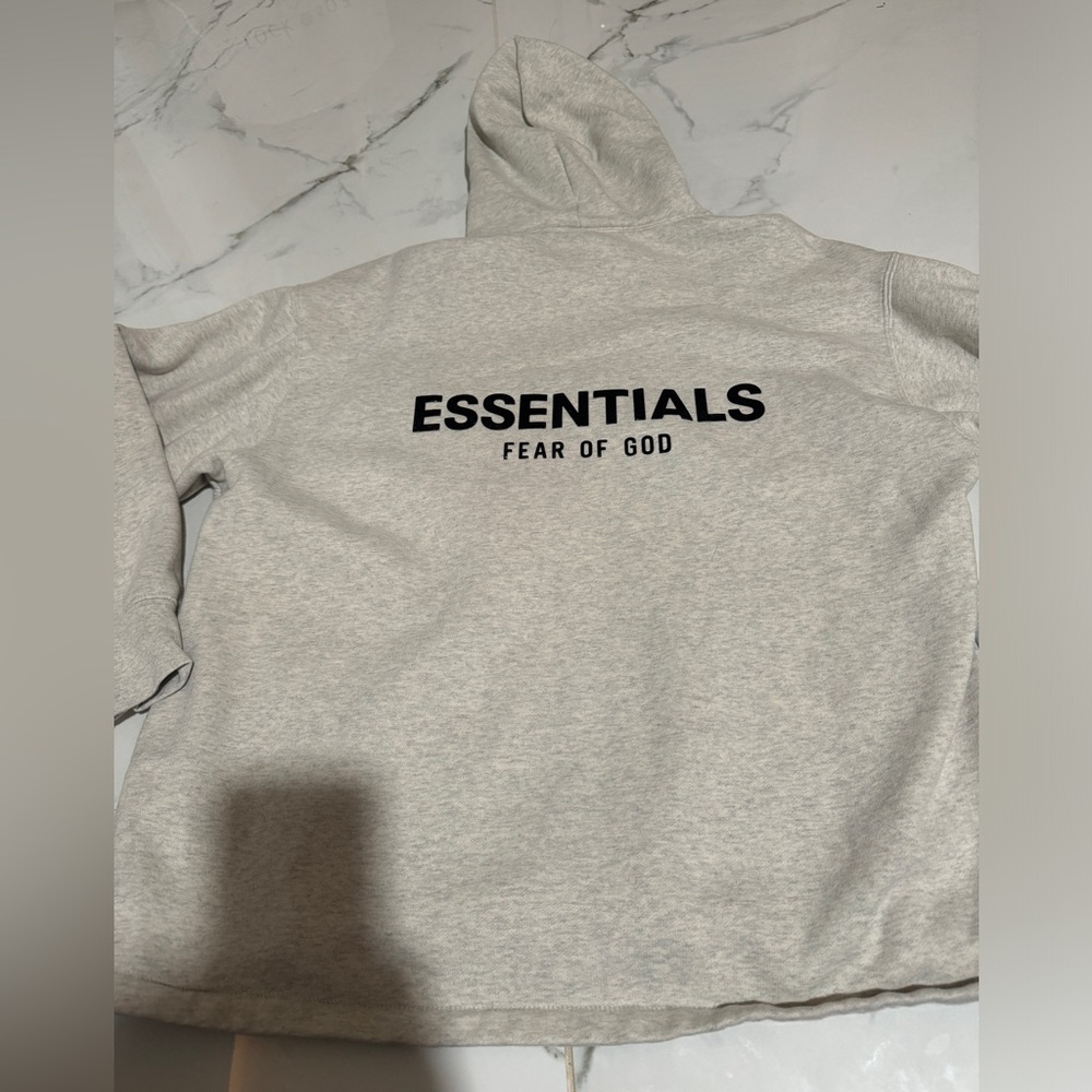 Fear of God ESSENTIALS Light Gray Hoodie with Black Logo